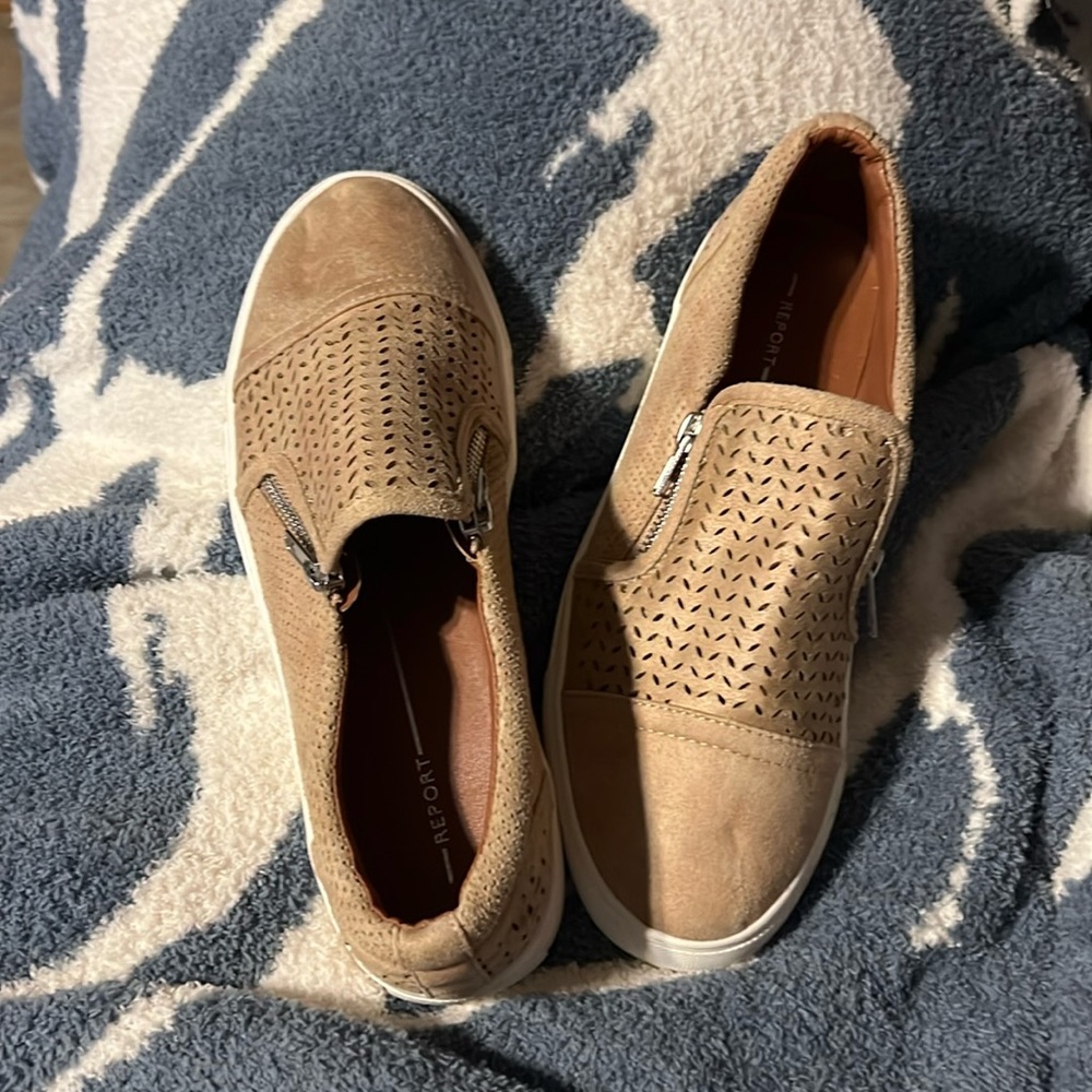 tan suede sneakers with zippers on both sides.  Report brand. Only worn once